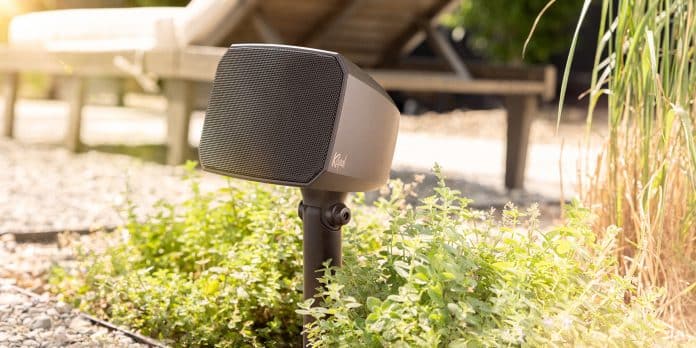 Klipsch-Courtyard-outdoor-speaker-in-plants-beside-patio-and-lounge-chair_2000x1000